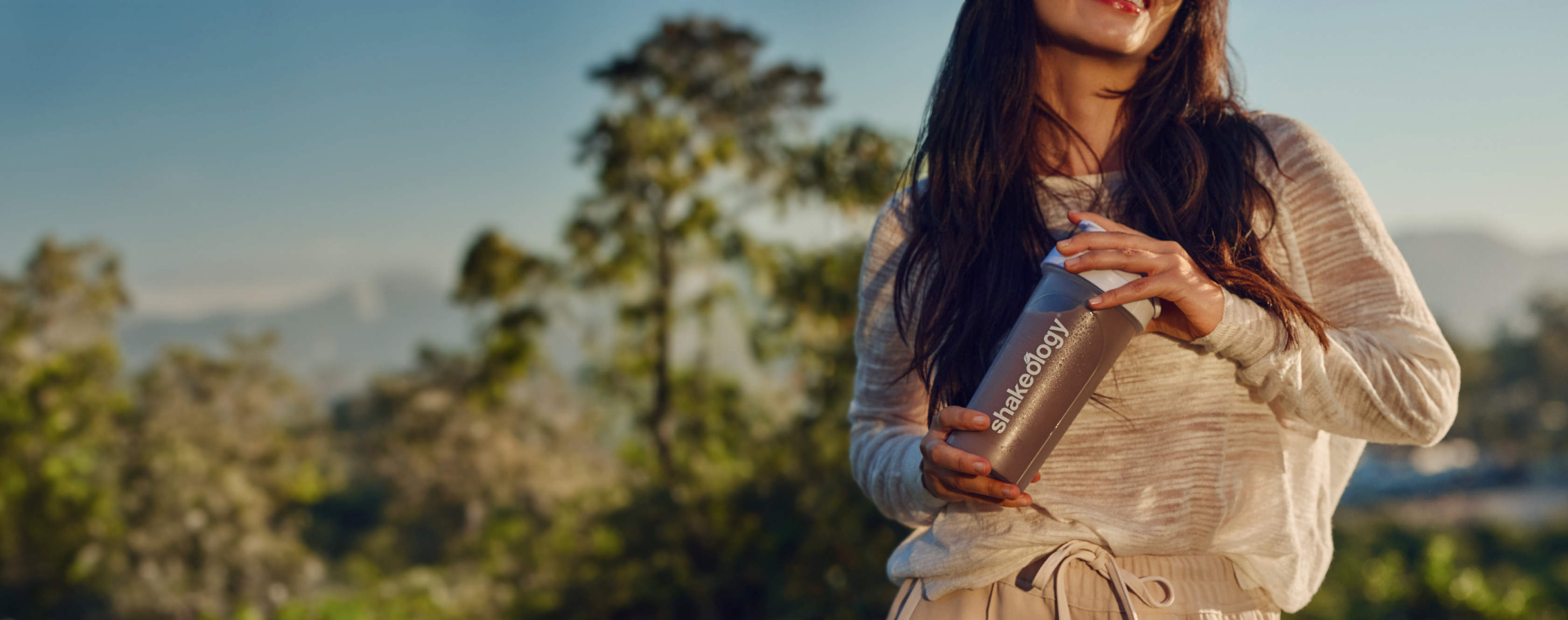 woman holding Shakeology